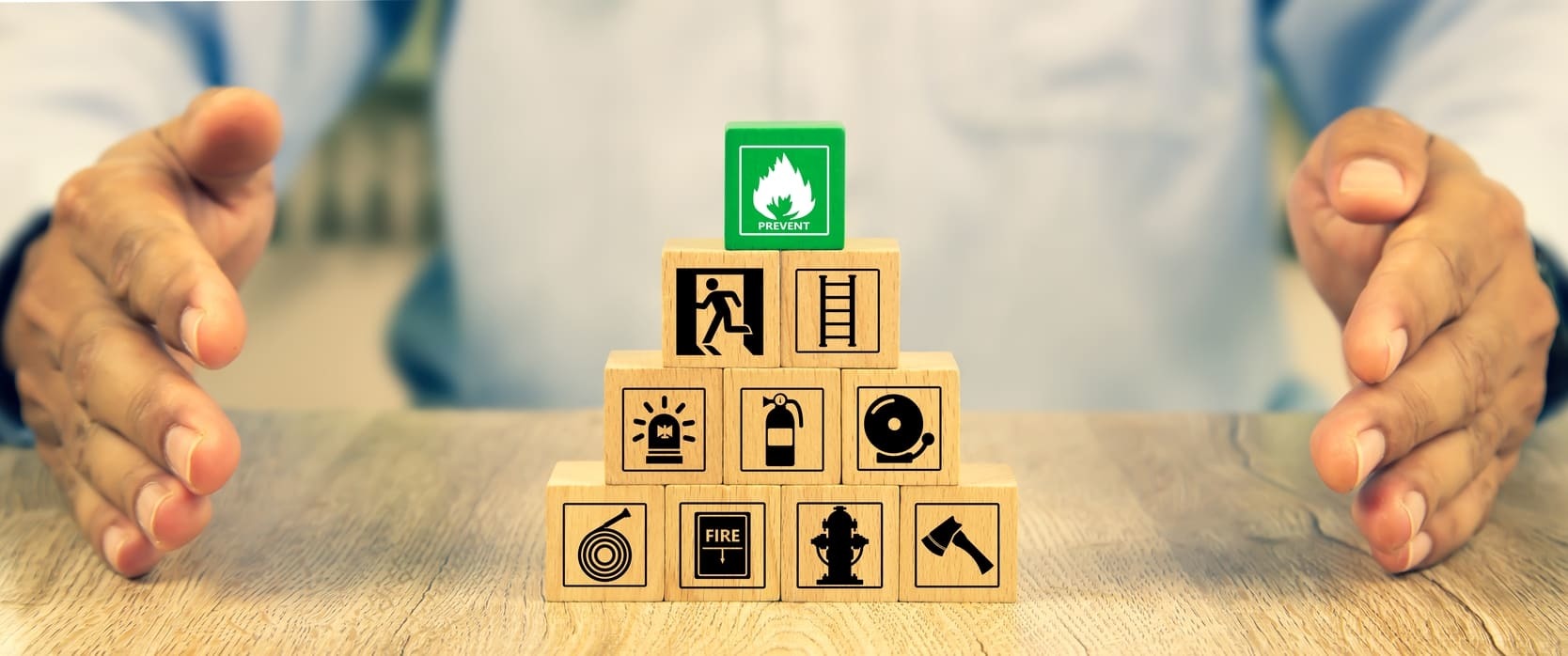 Blocks set up in a pyramid with fire safety tips